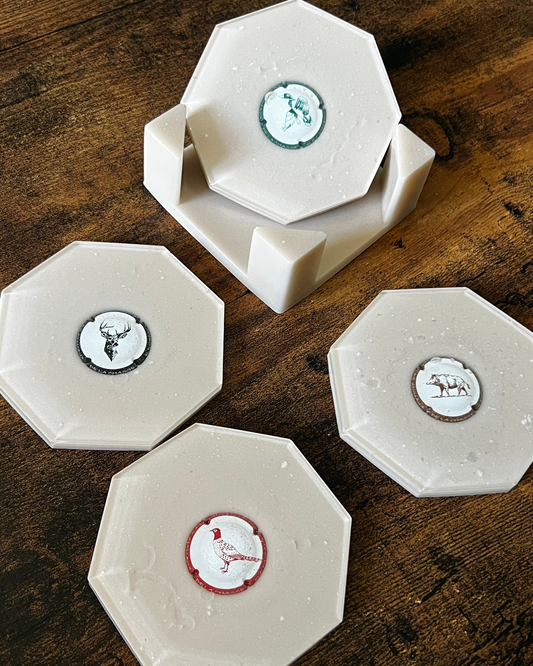 Dessous de verre hexagone beige et capsule de champagne chasse